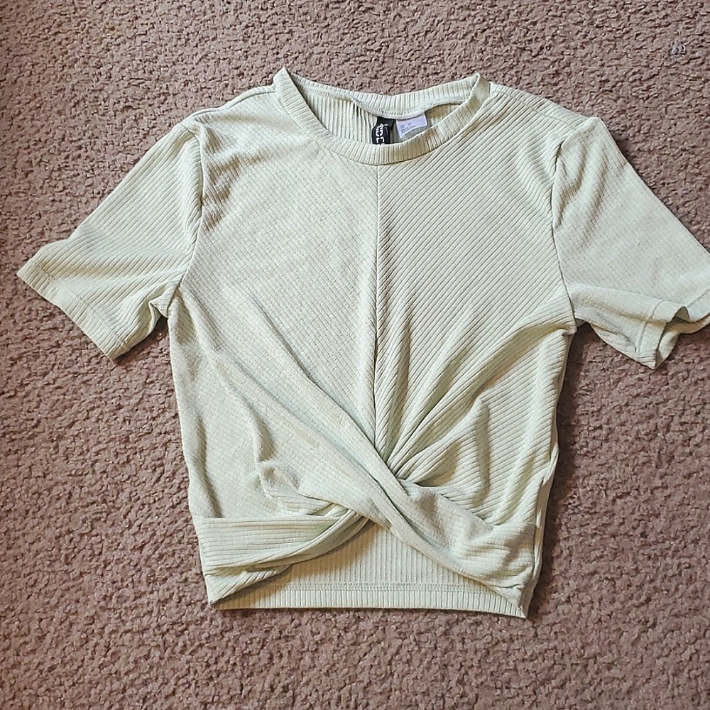 A light green shirt that's crossed in front